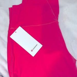 New with tag Size 14 LULULEMON Aligns in “Guava Pink”, high rise, 25”